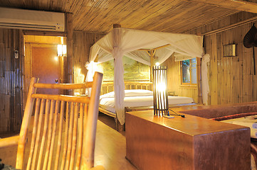 Image showing Bedroom in a wood bungalow. 