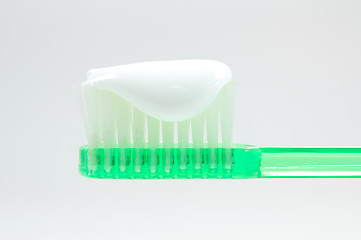 Image showing green toothbrush isolated on white 