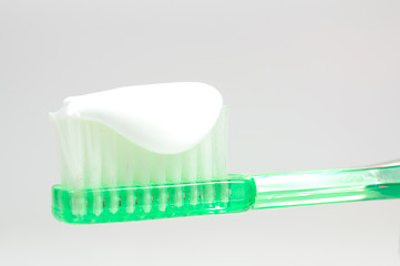 Image showing green toothbrush isolated on white 