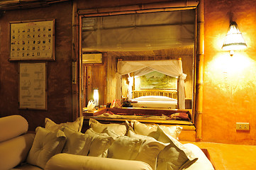 Image showing Bedroom in a wood bungalow. 