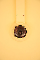 Image showing Old Vintage bakelite light switch isolated against white background from low perspective.