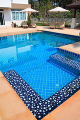 Image showing Swimming pool with stair and green relaxing water 