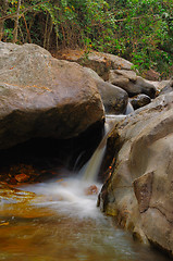 Image showing Waterfall with water flowing around 