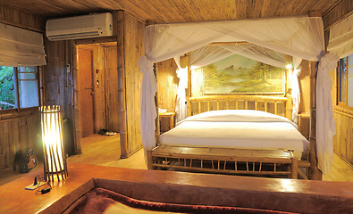 Image showing Bedroom in a wood bungalow. 