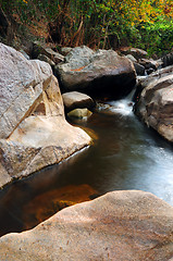 Image showing Waterfall with water flowing around 