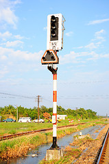 Image showing Traffic light shows red signal on railway. Railway station. 