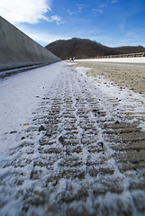 Image showing tire print on the snowy road