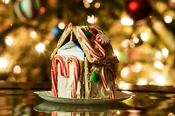 Image showing Gingerbread house against a background of christmas tree lights