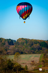 Image showing hot air balloon over farm land