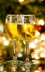 Image showing Two champagne glasses ready to bring in the New Year