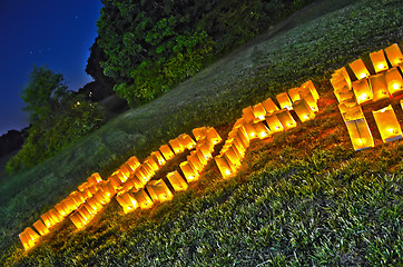 Image showing Hope spelled out with candles on grass field