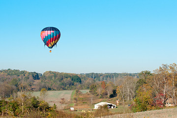 Image showing hot air balloon over farm land