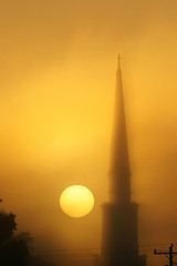 Image showing steeple in fog at sunrise