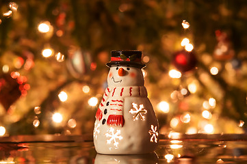 Image showing Festive snowman with Christmas light background