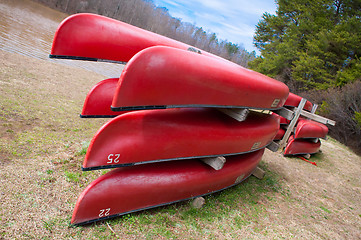 Image showing red kayaks