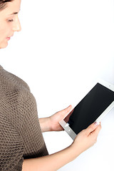 Image showing Woman reading a tablet screen