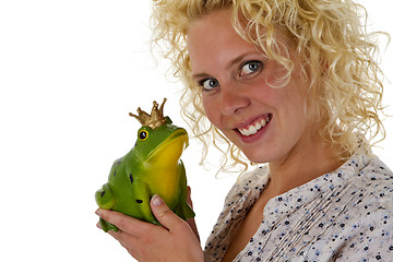 Image showing Young woman kissing a frog prince