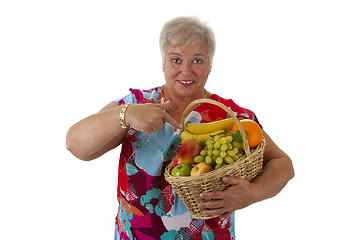 Image showing Female senior holding fruit basket