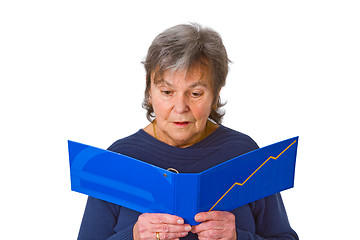 Image showing Female senior looking  at statement of account