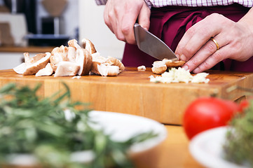 Image showing Man Cutting Mushrooms