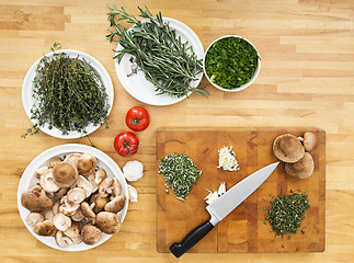 Image showing Vegetables And Chopping Board On Kitchen Counter