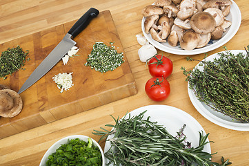 Image showing Vegetables With Chopping Board And Knife On Counter
