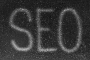 Image showing The word SEO handwritten with white chalk on a blackboard 