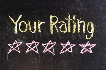 Image showing Five stars ratings web yellow written on blackboard background 