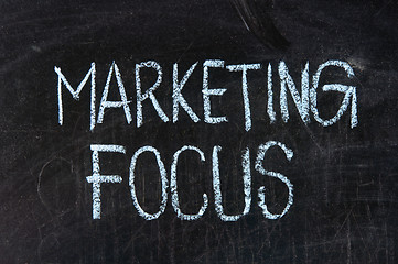 Image showing  The word MARKETING FOCUS handwritten with chalk  on a blackboard