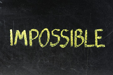 Image showing Chalkboard writing - concept of impossible or possible 