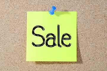 Image showing The word SALE Note paper with push pins on noticeboard 