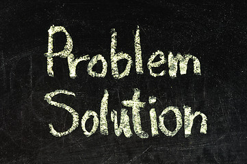 Image showing solution for a problem written on a chalk or black board 