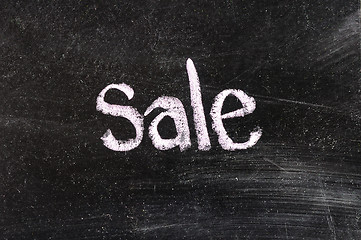 Image showing SALE handwritten with white chalk on a blackboard