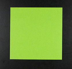 Image showing Green postit on a blackboard