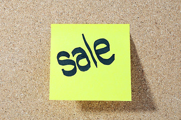 Image showing The word SALE Note paper with push pins on noticeboard 