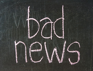 Image showing  The word BAD handwritten with chalk  on a blackboard