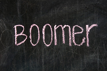 Image showing The word BOOMER handwritten with chalk  on a blackboard