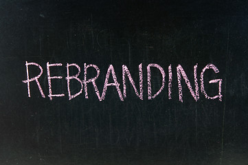 Image showing  The word REBRANDING handwritten with chalk  on a blackboard