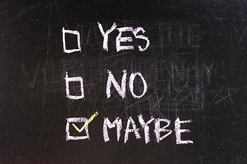 Image showing yes and no check boxes sketched with white chalk on blackboard with eraser smudges 