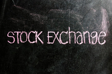 Image showing business STOCK EXCHANGE written on blackboard