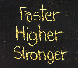 Image showing faster, higher, stronger on a blackboard