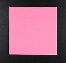 Image showing pink postit on a blackboard