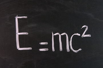 Image showing Formula e=mc2. Theory of relativity written on school chalkboard