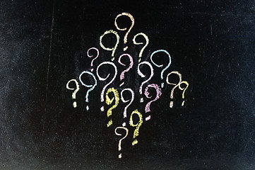 Image showing decision making or brainstorming concept - a collection of question marks 