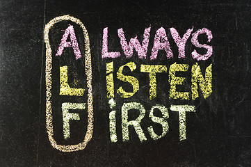 Image showing ALF acronym (always listen first) - good advice for training, counselling, customer service, selling or relationships, sticky notes and white chalk handwriting on blackboard
