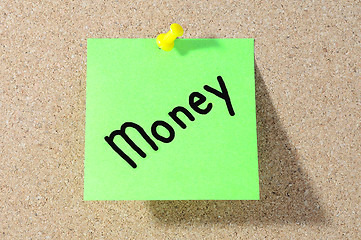 Image showing The word MONEY Note paper with push pins on noticeboard 