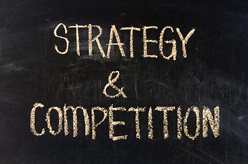 Image showing STRATEGY & COMPETITION  handwritten with chalk  on a blackboard