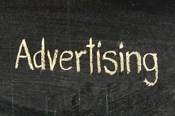 Image showing Advertising handwritten with white chalk on a blackboard
