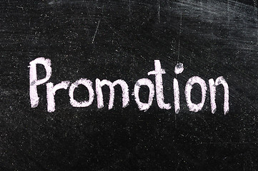 Image showing Promotion handwritten with white chalk on a blackboard