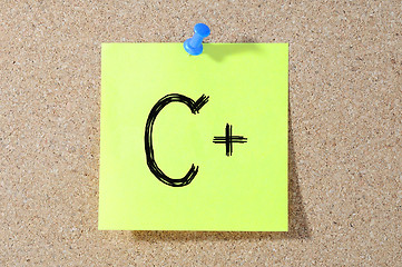 Image showing C+ grade written on a test paper. 